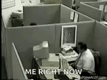 Man slams head on desk in cubicle