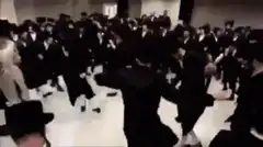 large group of people in black suits dancing