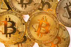 pile of gold bitcoin coins