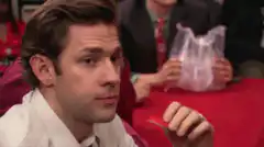 Jim Halpert holds up a red card