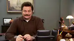 Ron Swanson Smiling at Desk