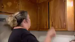 Woman hits cabinet door