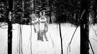 Two snow bunnies in the woods