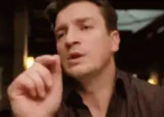 Jeremy Renner explaining something with hand gestures