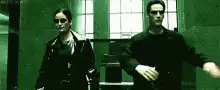 Trinity and Neo walking in The Matrix