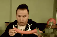 Man holding a large sausage