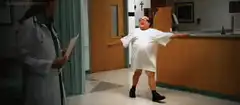 Man in hospital gown dancing