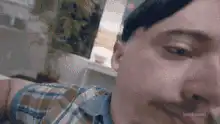 Man touches his forehead in confusion