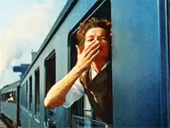 Woman waving from train window