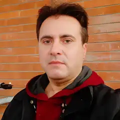 Man in red hoodie and black jacket