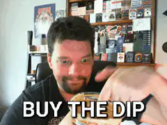 Man eating dip gives thumbs up