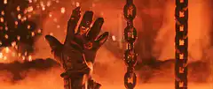 Gloved hand burns and breaks chains