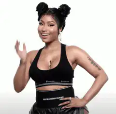 Nicki Minaj laughing and waving