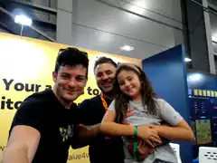 Man and girl hugging at convention