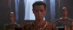 Ra's al Ghul and the heroes kneel