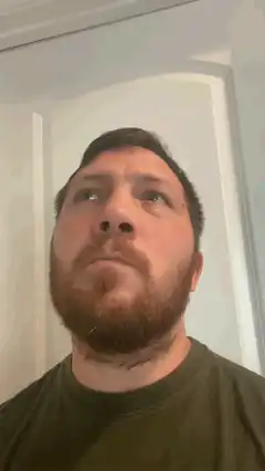 Man looking up with a confused expression