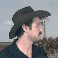 Man tipping cowboy hat