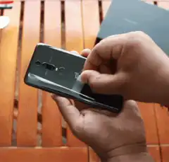 Peeling plastic off new phone