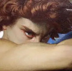 Crying man with curly hair painting
