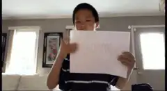 Boy flips paper from Boom to Roasted