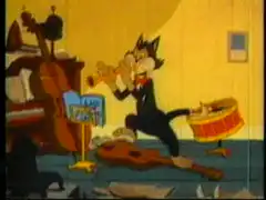 Sylvester playing trumpet with broom