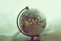 Globe with glowing orange dots