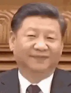 Xi Jinping smiling and nodding
