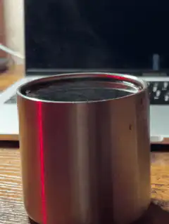 Red light reflection on metal cup