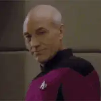 Captain Picard smirks and turns away