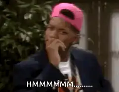 Man in pink hat thinking hmm