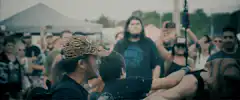 Man in tiger hat crowd surfing