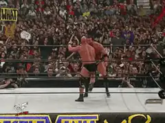 Wrestler hits a splash in the ring
