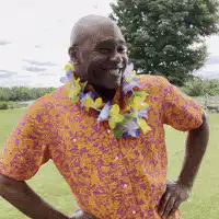 Man in Hawaiian shirt laughing