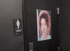 Men and Women bathroom doors with pictures