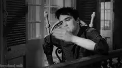 Elvis Presley blowing a kiss