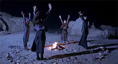 Witches dancing around a bonfire