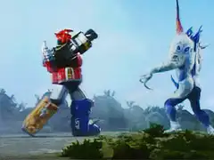 Red Ranger kicks monster