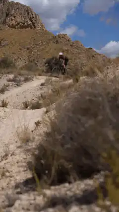 Mountain biker riding downhill with glitch effect
