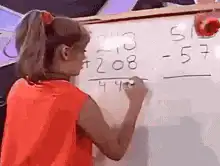 Girl adds 248 and 208 on whiteboard