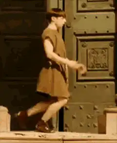 Boy in dress doing a silly dance