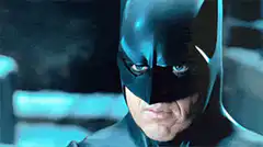 Batman smirks and smiles