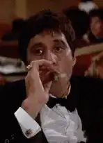 Michael Corleone smoking a cigar