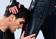 Man kissing woman's thigh