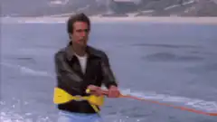 Brody water skiing over shark