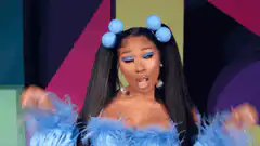 Nicki Minaj dancing with blue hair buns