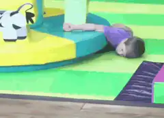 Toddler passes out on play gym