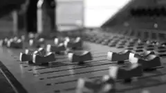 Close up of audio mixing console faders