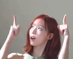 Woman pointing up with both hands then one