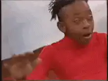 Man in red shirt waving hand