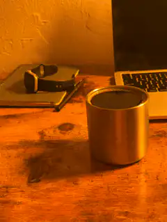 steaming metal cup on desk